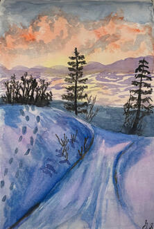 Sunset over a lake and snowy elevations